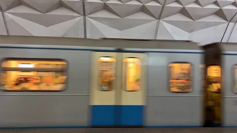 Subway train with people inside moving fast from metro station, close up Stock Footage 277076268