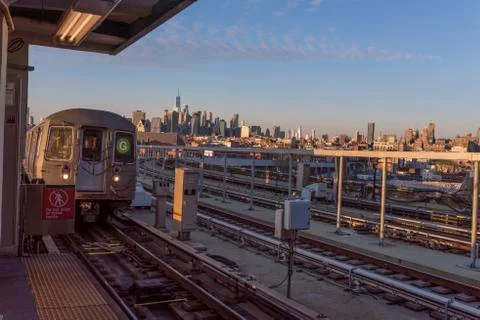 Subway train pulls into elevated track in NYC 写真素材
