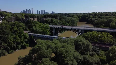 Subway train pulls out of tunnel and pans over to it going into t 動画素材 137108969