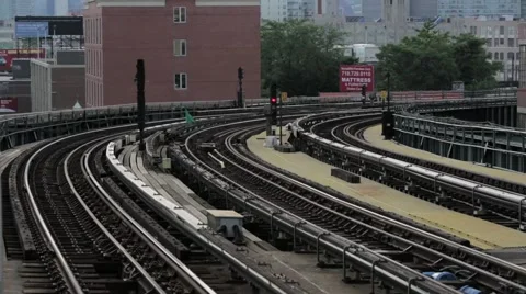 Subway Train rolls into station in Queens Stock Footage 40521299