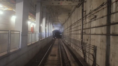 Subway train running through the tunnel. Train traveling through the underground Video stock 102691346
