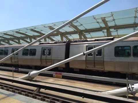 Subway train slowing down then stopped in the station Foto stock