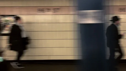 Subway train speeding past platform in New York City NYC Stock Footage