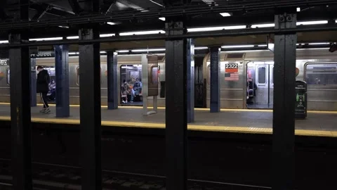 Subway train standing in station at West 14th Street in NYC. Stock Footage 200658254