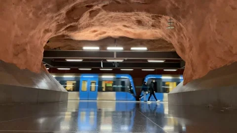 Subway train station with a moving train and people going home Stock Footage 150710102