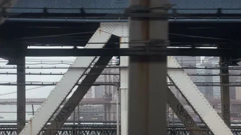 Subway train view across Brooklyn Bridge crossing to Manhattan New York City Stock Footage 165228257