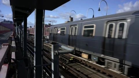 Subway Train on Williamsburg Bridge heading from Brooklyn to Manhattan Stock Footage 199729679