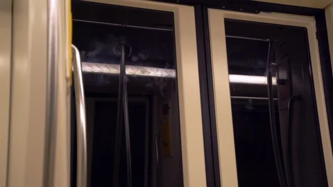 Subway underground train car doors during motion. An interior view of the doors Stock-Footage 122867537
