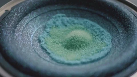Subwoofer Audio Speaker Vibrations with Blue and Green Glitter in Slow Motion Stock Footage 82956546
