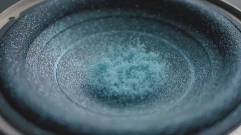 Subwoofer Audio Speaker Vibrations with Blue Glitter and Sparkles in Slow Motion Stock Footage 82956633