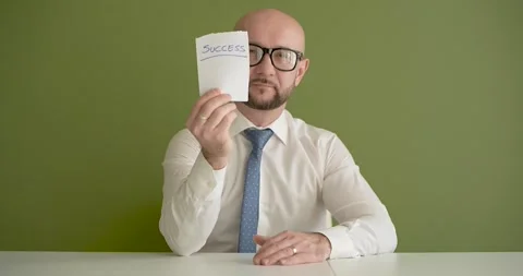 Succes  - A man presents a note with the word Stock Footage 267088479