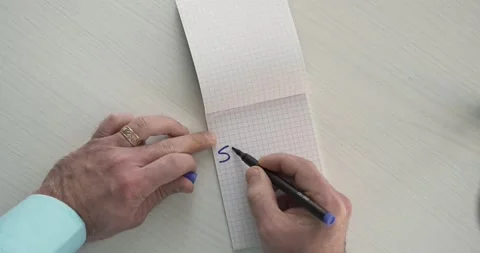 Succes  - this word is written on the sheet by a man's hand Stock Footage 267083790