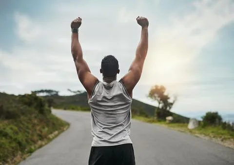 Success, back and runner outdoor with arms up, cardio goal or celebration i.. Stock Photos