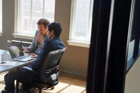Success is better when its shared. businessmen working in their office. Stock Photos