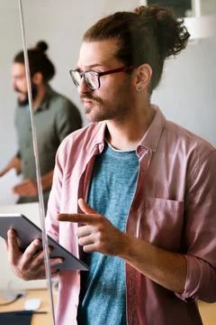 Success business man with tablet, analytics and developer for startup business Stockfoto's