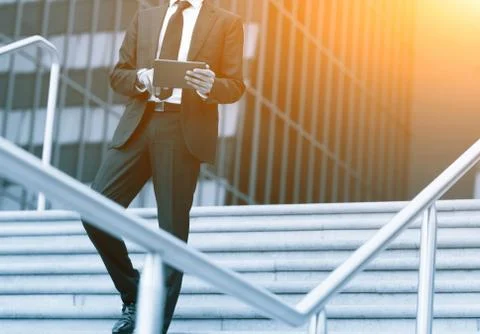 Success business man using tablet phone. Blue Toned Image. Concept businessma Foto stock