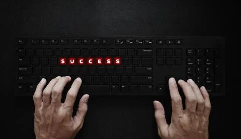 Success concept. Hand typing on computer keyboard and SUCCESS on red buttons Stock Photos
