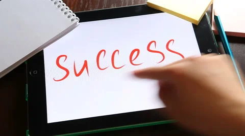 Success concept, hand writes word success on tablet at workplace Stock Footage 62949632