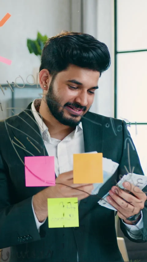 Success concept where handsome smiling skilful bearded developer looking on glas Video stock 329187239