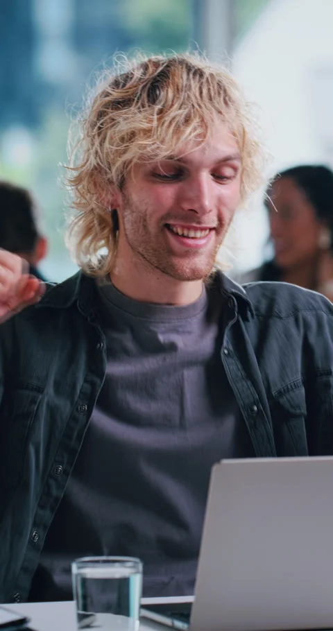 Success, editing or programmer in office with laptop, bug fix or good news in Stock Footage 333606873