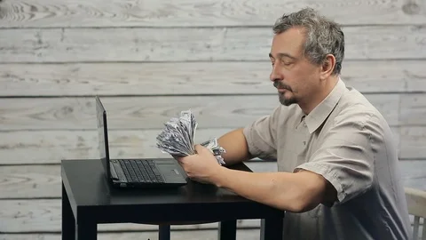 The success of freelancer working at the computer Stock Footage 98422159