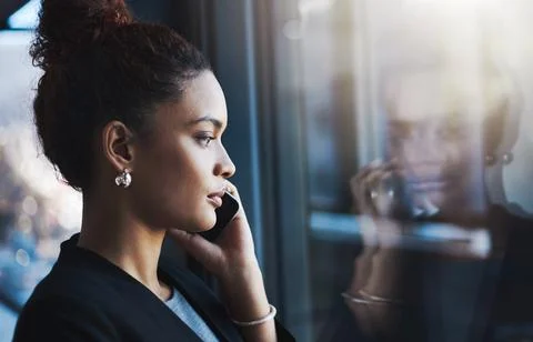 Success happens on her command. a young businesswoman talking on a cellphone in Foto stock