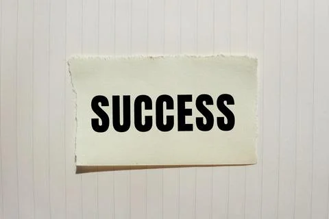 Success message written on ripped torn paper background. Conceptual Success.. Stock Photos
