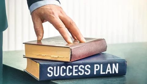SUCCESS PLAN text concept write on book on wooden background Stock Photos