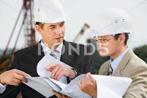 Successful architect is explaining a conditions of project to the customer Stock Photos