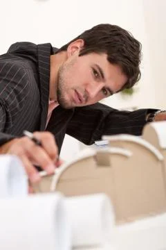 Successful architect working at office Stock-Fotos