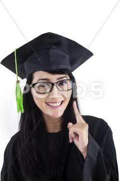 Successful bachelor in graduation gown Stock Photos