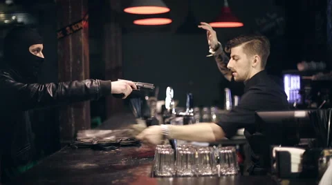 Successful bar robbery. The robber breaks into a bar and takes the money Stock Footage 43876569