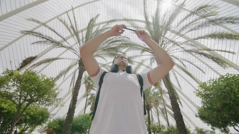 Successful blogger using his smartphone and broadcasting online Stock Footage 235488168