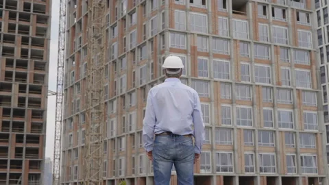A successful builder engineer in a white helmet 4K Stock Footage 112026750