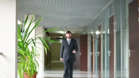 Successful business man having cell telephone conversation while standing in Stock Footage 61816680