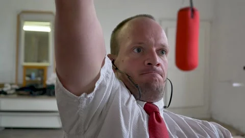 Successful business man pulling a cable heavy dumbbell. concept of multitasking Stock Footage 154305674