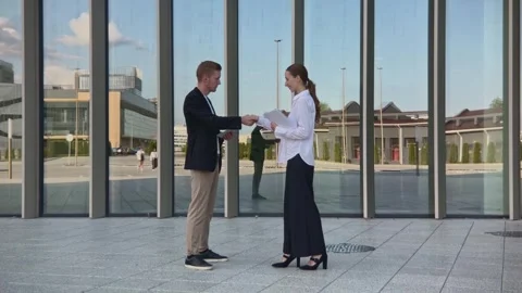 Successful business partners man and woman shake hands at meeting end Stock Footage 254971053