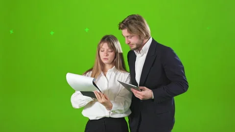 Successful business partners standing in studio, working, talking, discussing. Video stock 237610514