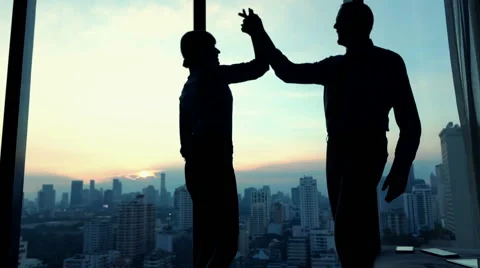 Successful business people giving high five in office, slow motion Stock Footage