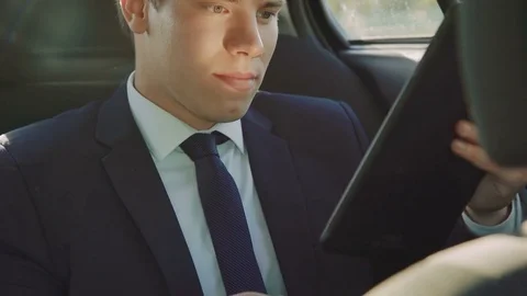 Successful businessman happy of getting a news on the tablet 4K Stock Footage