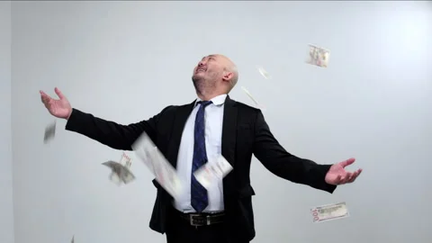 Successful Businessman Laughing While Throwing a Stack of Banknotes Stock Footage 336896772