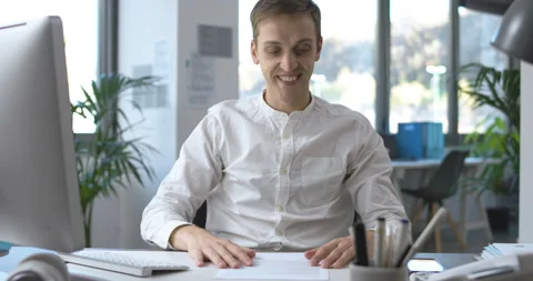 Successful businessman reading paperwork Stock Footage 168367840