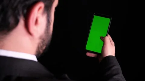 Successful Businessman tapping or scrolling on mobile phone smartphone and Video stock 336249000