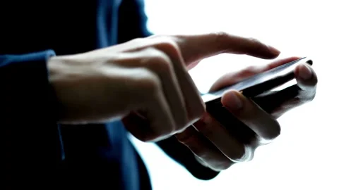 Successful Businessman tapping or scrolling on mobile phone smartphone and Stock-Footage 336249536