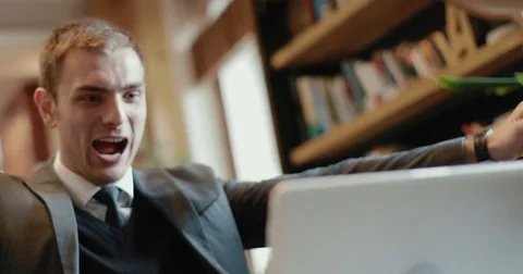 Successful businessman using a laptop Stock Footage 73016525