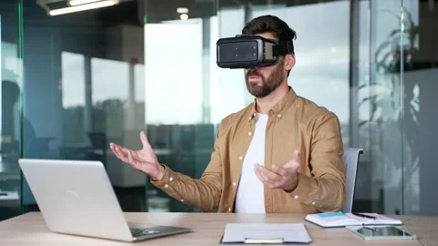 Successful businessman using VR glasses for video call and online chat  Stock Footage 295042631
