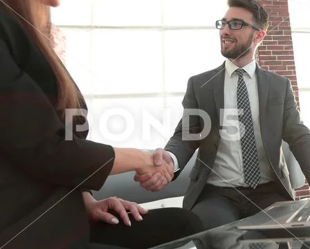 Successful businessmen handshaking after good deal. Stock Photos