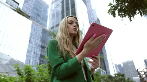 Successful businesswoman using digital tablet in manhattan Stock Footage 346368979
