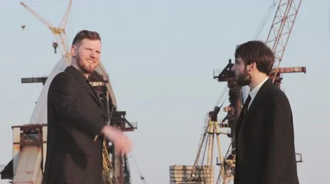 Successful construction business partners do a handshake after a business meetin Stock Footage 62872848