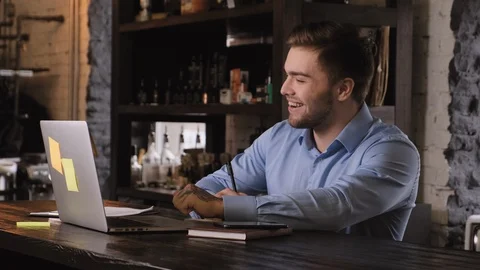 Successful contented, pleasant-looking, bearded guy finishes work Stock Footage 104143256